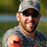 Happy customer showing fishing gear